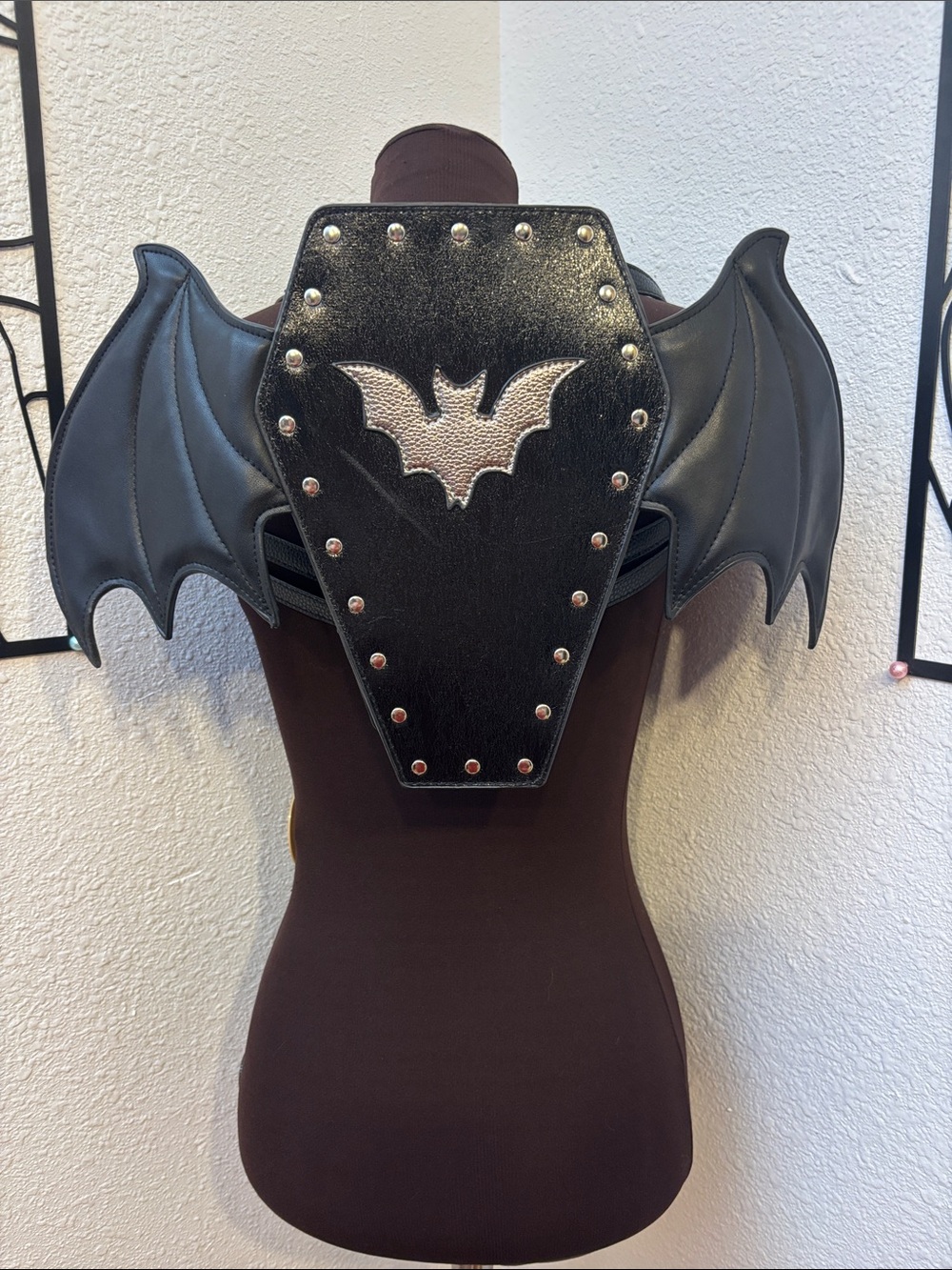 Black & Silver Bat Wing Faux Leather Backpack with Adjustable straps.